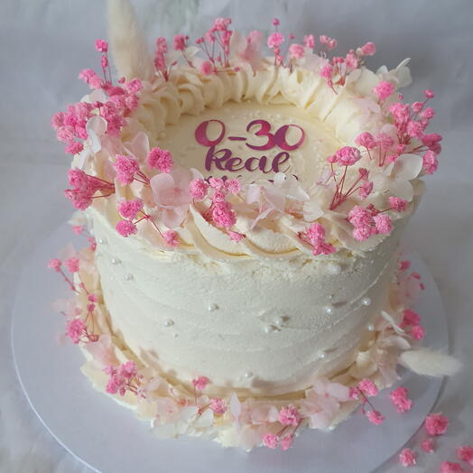 White cake with pink flowers