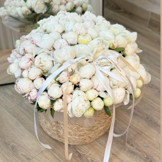 Basket with white peonies