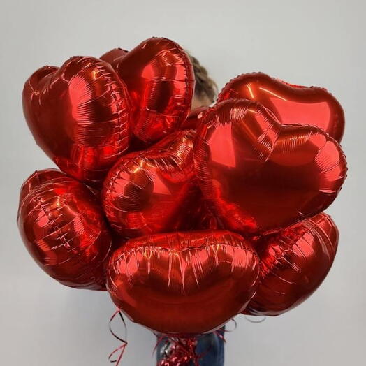 12 heart-shaped red balloons
